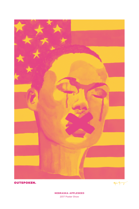 A person of color with short hair, streaking their face, in front of an American flag. An "X" covers their mouth.